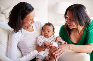 Postpartum doula helping new mom