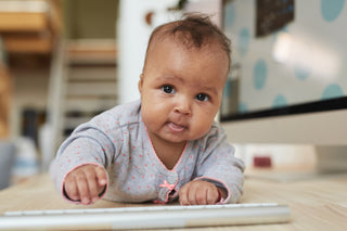 Baby girl attempts to crawl