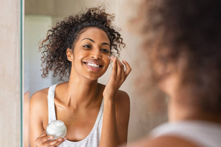 Woman using pregnancy-safe skincare while expecting