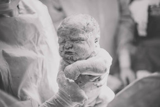 Newborn baby covered in vernix
