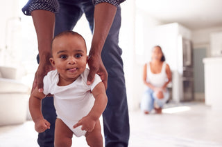 A baby learning to stand