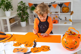 Toddler doing easy Halloween crafts