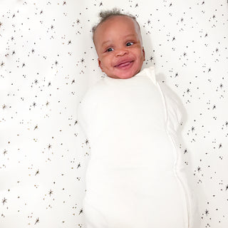 https://www.happiestbaby.com/cdn/shop/products/sleepea-comforter-swaddle-ivory-baby-arms-in-happy_320x.progressive.png.jpg?v=1698443391